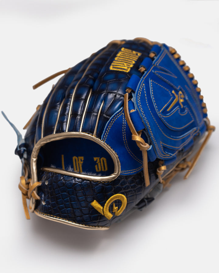 Blue baseball glove with gold accents on a white background