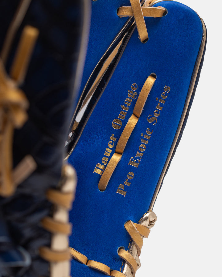 Blue and gold hockey stick with 'Bauer Outage Pro Exotic Series' branding on a white background