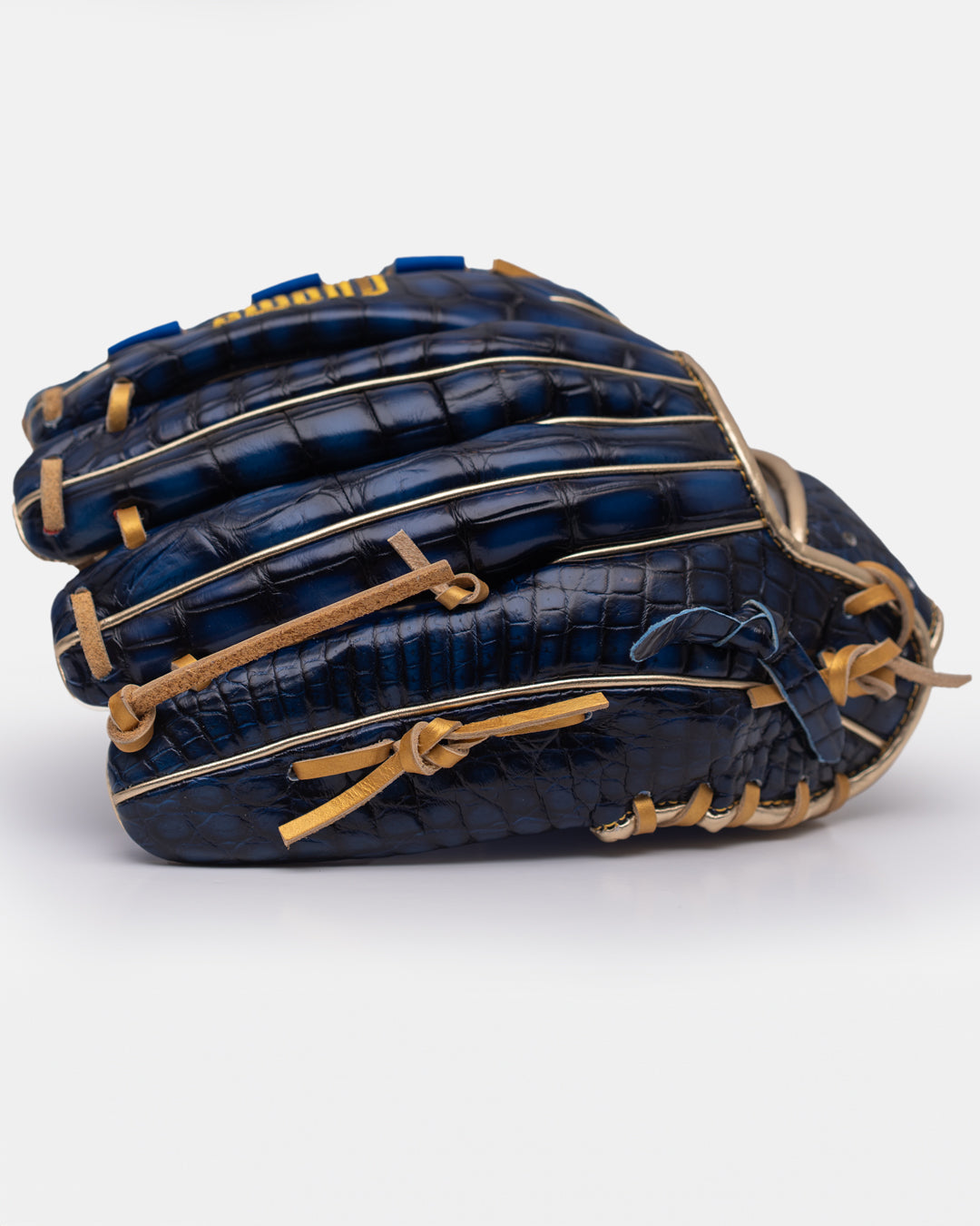 Blue baseball glove with tan stitching on a white background