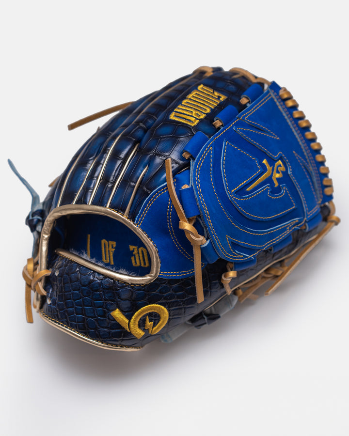 Blue and gold baseball glove with brand logo on a white background